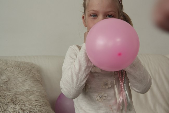 Blowing balloons